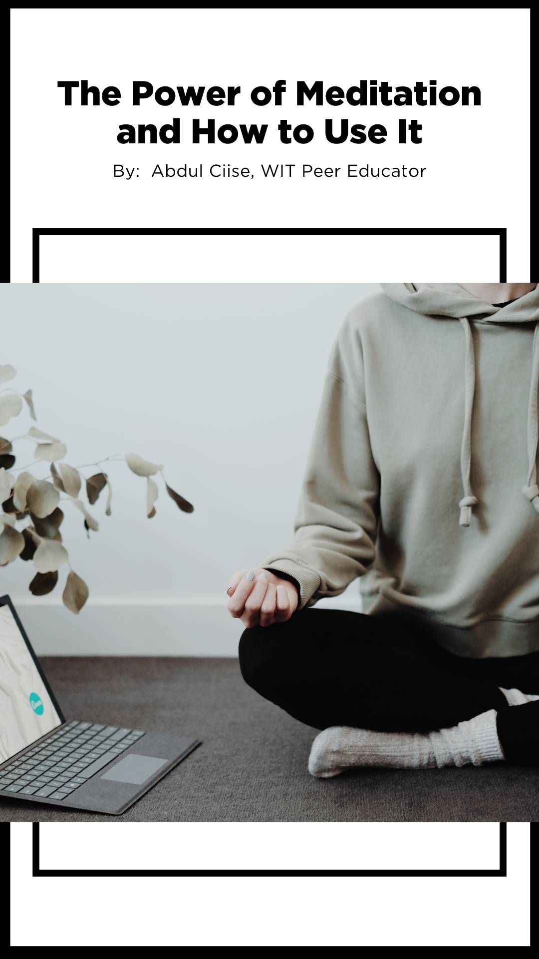 Image of a person meditating in comfy clothes by an open computer.